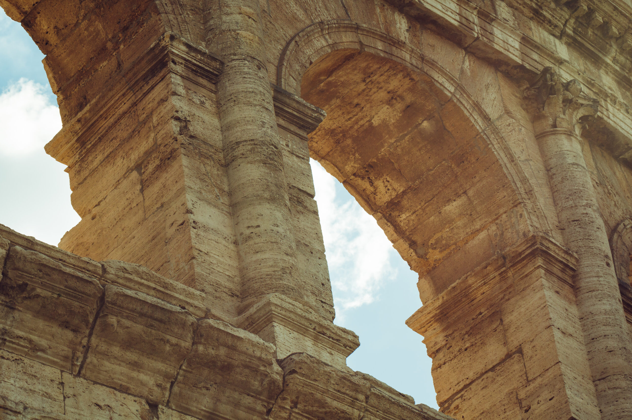 Close-up of arches of Coliseum, Roma, Italy.