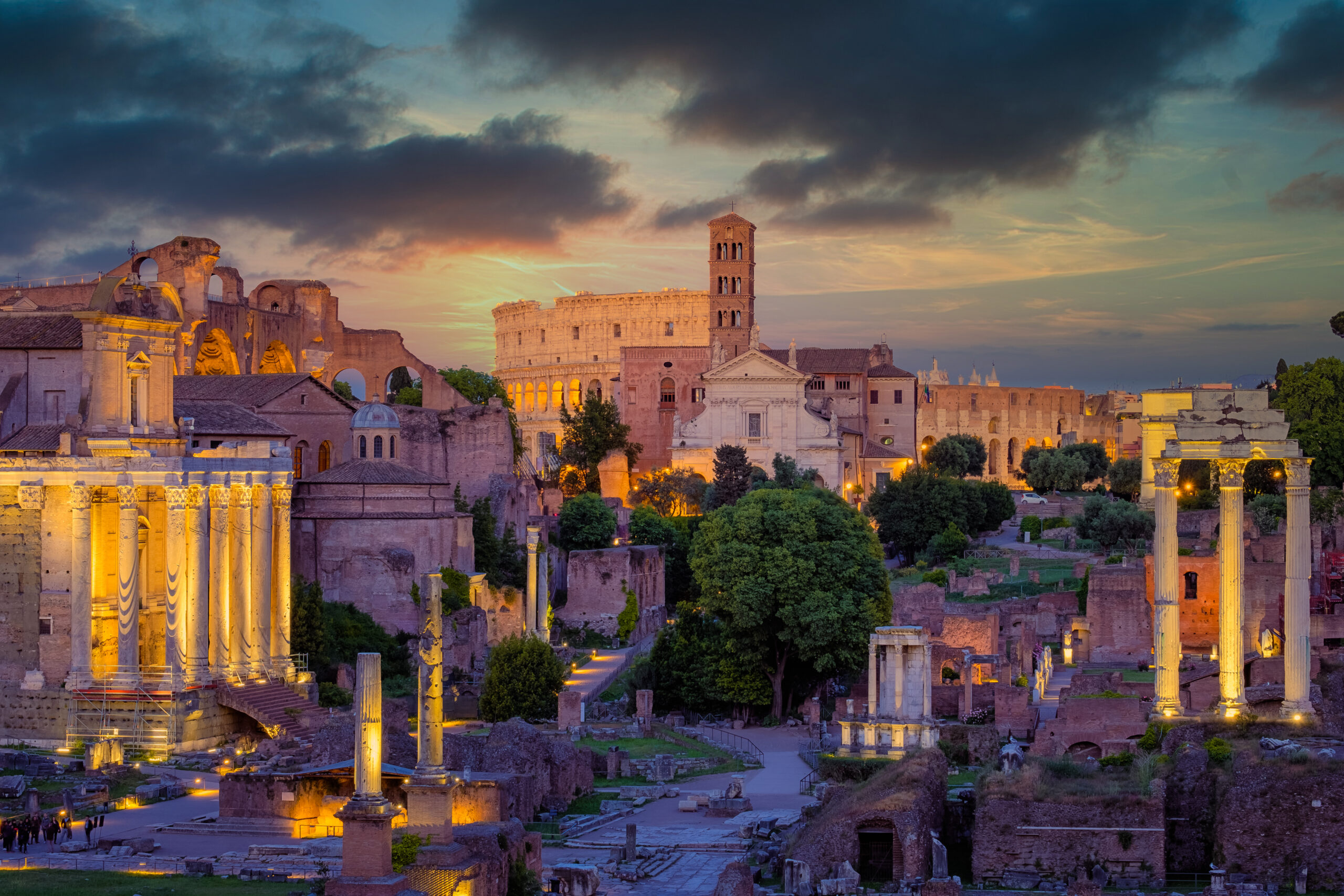 Forum Romanum and Colosseum in Rome with dramatic colorful sky, Italy